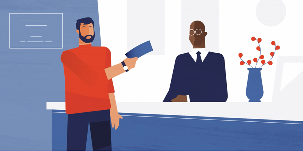 Man depositing a check in the bank.