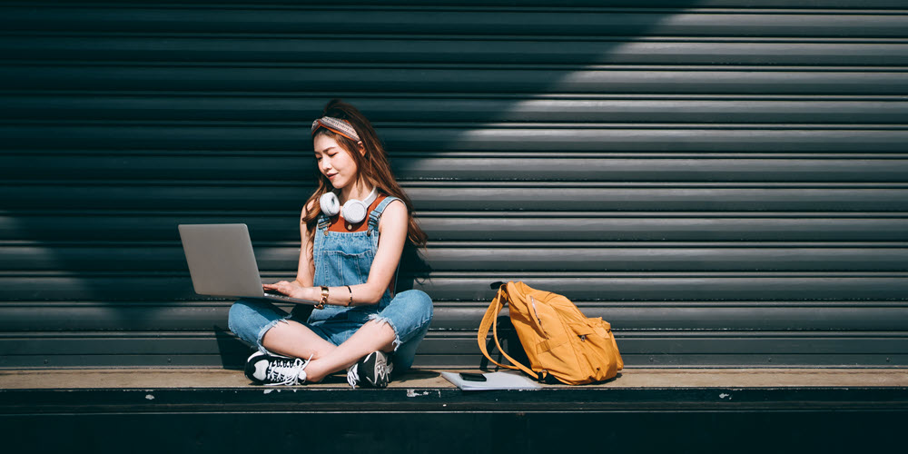 College student opening a checking account online.