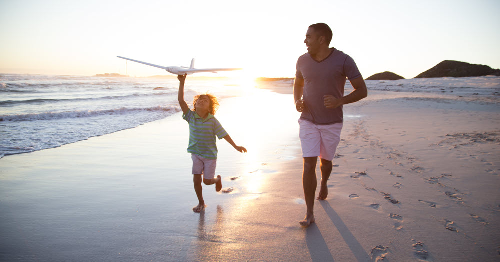 Father and son on beach