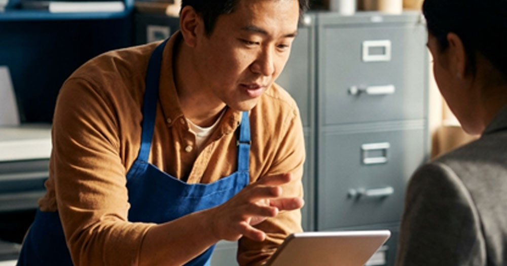 Business owner talking to customer 