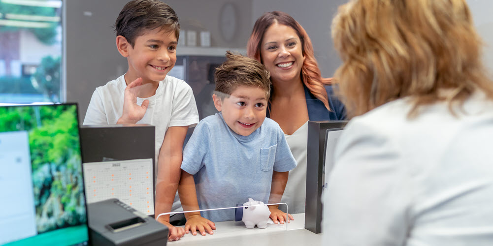 Kids at the bank teller window.