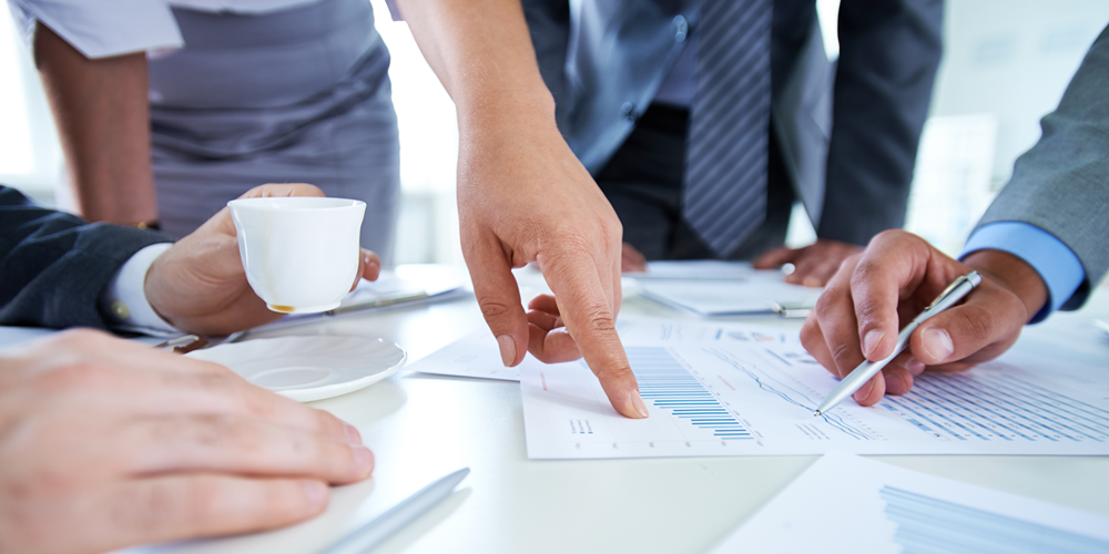 Business professionals discussing money management.