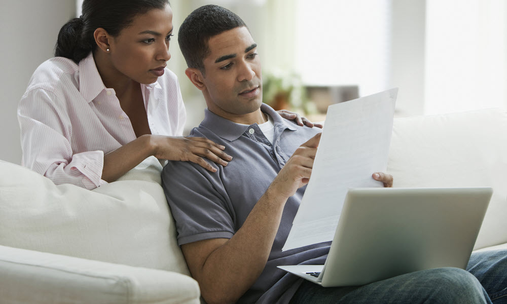 Couple Reviewing Credit Report
