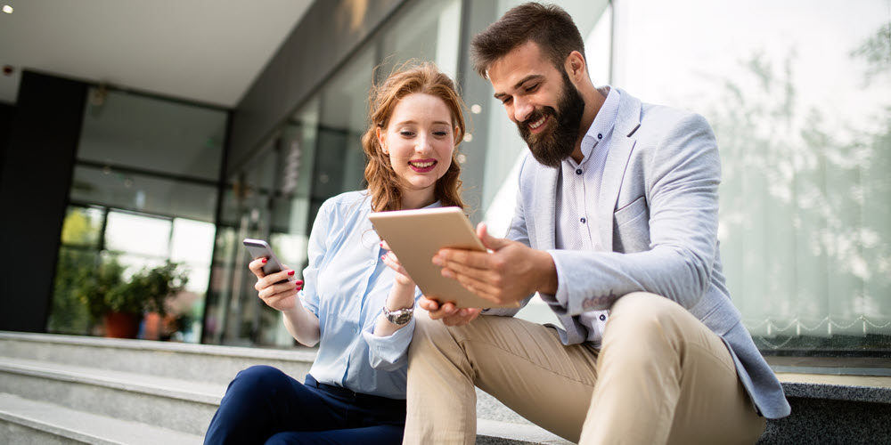 Couple reviewing tax return deposit options.