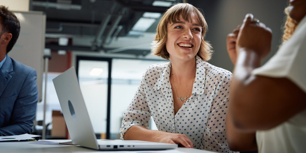 young professional in meeting with coworker.