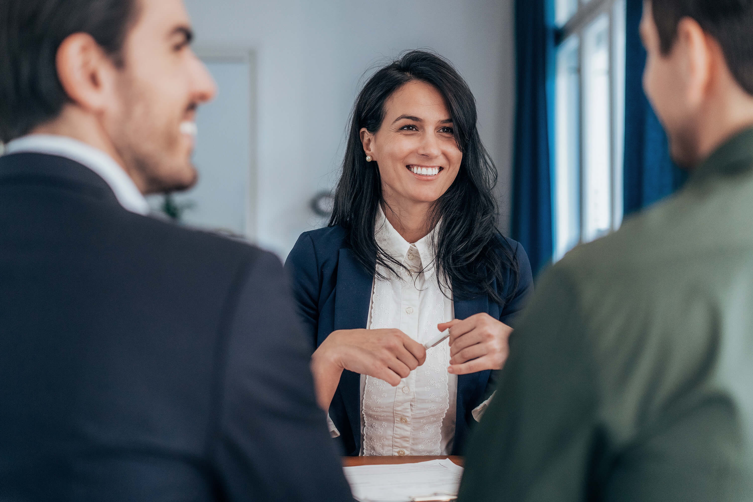 Woman smiling across counter