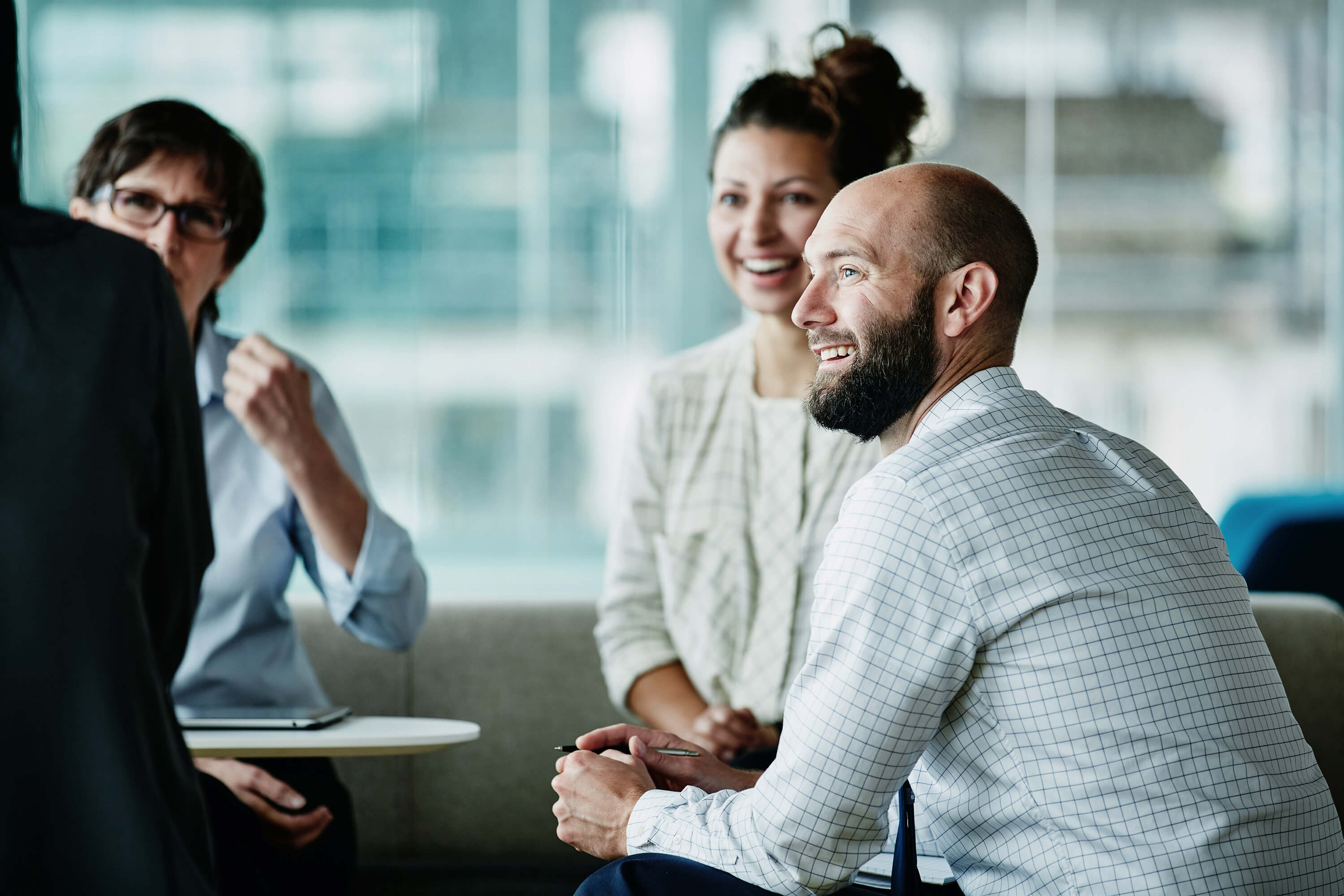 Woman and man in business attire sitting at table