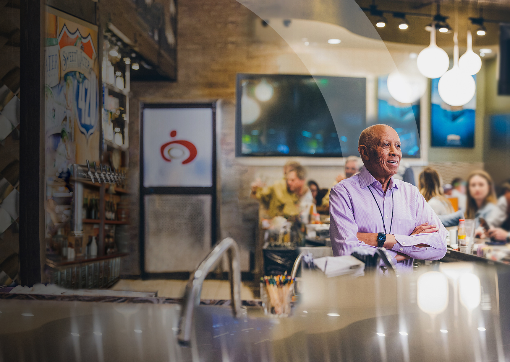 A photo of Mack sitting in his restaurant