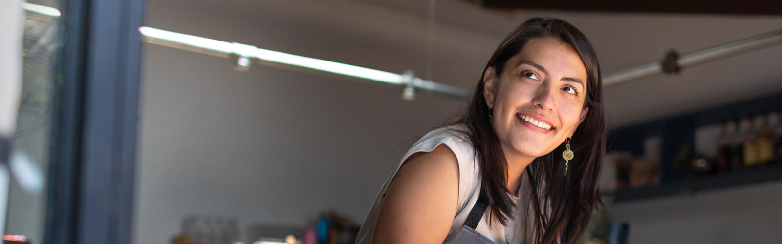 Woman working in shop smiling