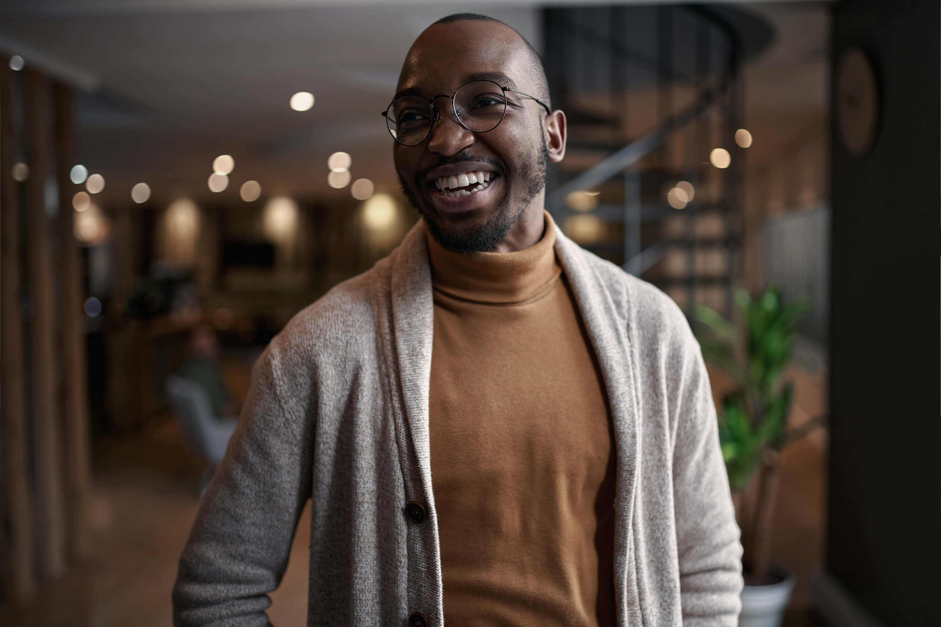 Man with glasses smiling