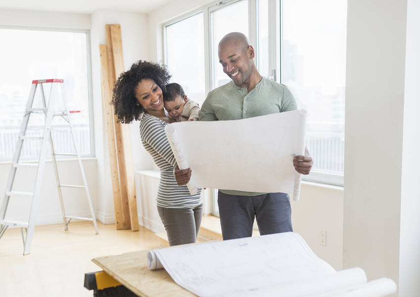 family with new home construction plans