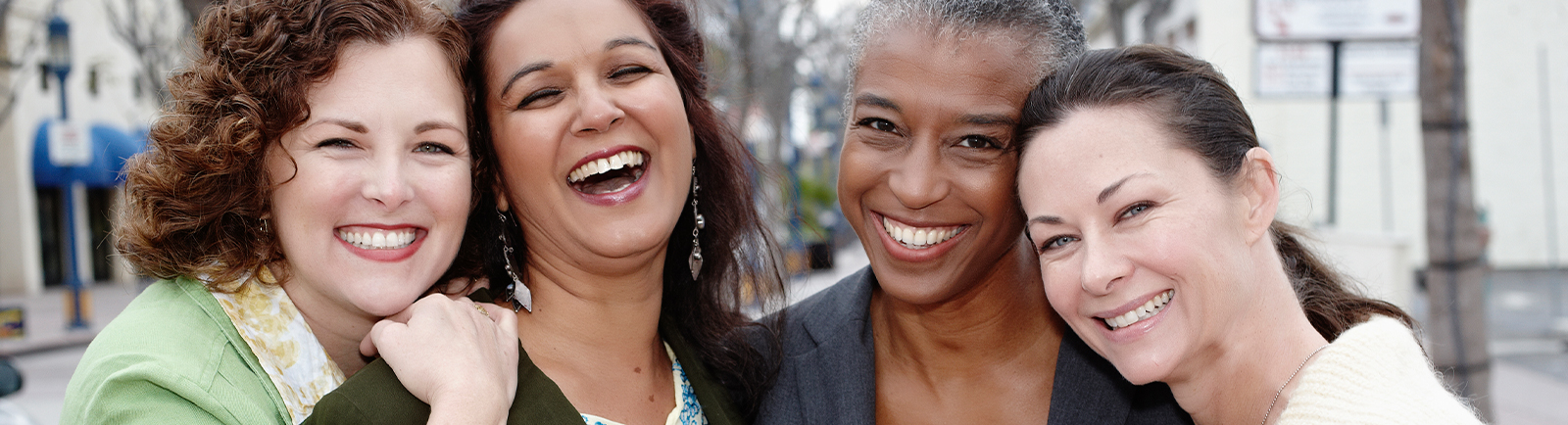 A group of women laughing together.