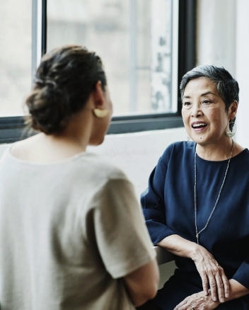 Associate and client chat in an office