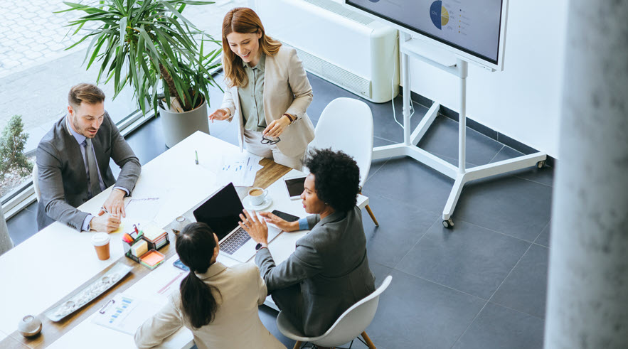 Commercial bankers in a strategic planning session with clients.